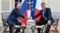 French President Emmanuel Macron, right, shakes hands with Russian President Vladimir Putin after their meeting at the fort of Bregancon in Bormes-les-Mimosas, southern France, Aug. 19, 2019. 