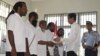 This Antara Foto photo shows Indonesia's President Joko Widodo shaking hands with and officially pardoning five political prisoners during a ceremony at a prison in Jayapura, Papua province, May 9, 2015.