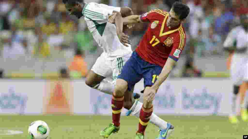 Nigeria's John Obi Mikel, left, and Spain's Alvaro Arbeloa challenge for the ball.