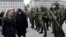 FILE - German Defense Minister Ursula von der Leyen, left, and Lithuania's President Dalia Grybauskaite attend a ceremony to welcome the German battalion being deployed to Lithuania as part of NATO deterrence measures against Russia in Rukla, Lithuania, F