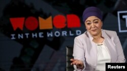 FILE - Gulchehra Hoja, a Uyghur journalist who then worked for Radio Free Asia, speaks on stage at the Women in the World Summit in New York, April 11, 2019.