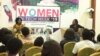 Aseda Addai-Deseh, left, and Lily Edinam Botsyoe speak to participants at the Women in Tech Week in Accra. (S. Knott/VOA)