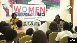 Aseda Addai-Deseh, left, and Lily Edinam Botsyoe speak to participants at the Women in Tech Week in Accra. (S. Knott/VOA)