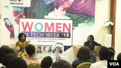 Aseda Addai-Deseh, left, and Lily Edinam Botsyoe speak to participants at the Women in Tech Week in Accra. (S. Knott/VOA)