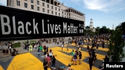 A street sign of Black Lives Matter Plaza is seen near St. John's Episcopal Church, as the protests against the death in Minneapolis police custody of George Floyd continue, in Washington, U.S., June 5, 2020.