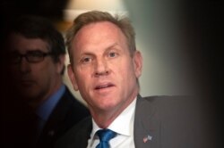 FILE - Acting Secretary of Defense Patrick Shanahan responds to reporters' questions at the Pentagon, June 7, 2019.