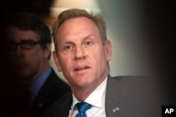 FILE - Acting Secretary of Defense Patrick Shanahan responds to reporters' questions at the Pentagon, June 7, 2019.