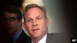 FILE - Acting Secretary of Defense Patrick Shanahan responds to reporters' questions at the Pentagon, June 7, 2019.