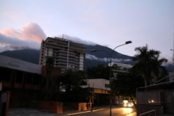 People walk on the street during a blackout in Caracas, Venezuela, July 22, 2019.