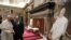 Vatican Pope and Journalists: Pope Francis looks at a painting he received from the Italian Order of Journalists on the occasion of their audience, at the Vatican, Thursday, Sept. 22, 2016. 