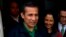 FILE- Peru's former President Ollanta Humala and his wife, Nadine Heredia, talk with journalists as they leave the headquarters of Peru's National Party in Lima, Peru, July 13, 2017.