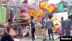 FILE: People inspect a damaged playground following an air strike in Mekelle, the capital of Ethiopia's northern Tigray region, August 26, 2022 in this still image taken from video. Tigrai TV/Reuters TV via REUTERS