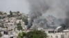 FILE - A house set ablaze by gangs burns amid ongoing violence in Port-au-Prince, Haiti, Feb. 26, 2025. Violence continued on Tuesday, when armed gangs attacked the Carrefour Feuilles neighborhood of Port-au-Prince.