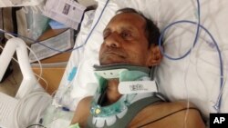 FILE - Sureshbhai Patel is shown in a February 7, 2015, photo in a bed at Huntsville Hospital in Huntsville, Alabama.
