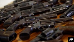 Shown is a collection of guns turned in during the first day of a national disarmament campaign in Rio de Janeiro, Brazil, May 6, 2011. Late last year, Brazil's foreign ministry sent a letter to its embassies instructing them to promote the country's ligh