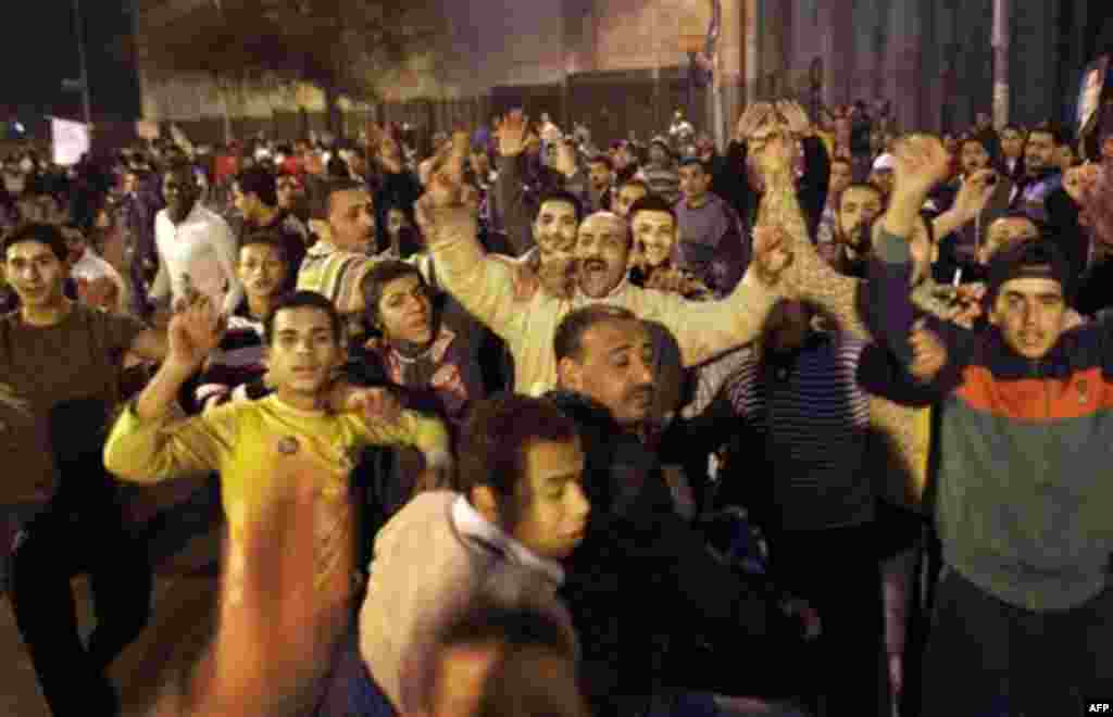 A group of pro-government supporters take to the streets following Egyptian President Hosni Mubarak's speech, in the Imbaba neighborhood of Cairo, Egypt, Wednesday, Feb. 2, 2011. After Mubarak announced Tuesday he would not run for a new term in September