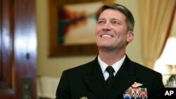 U.S. Navy Rear Admiral Ronny Jackson, M.D., sits with Sen. Johnny Isakson, R-Ga., chairman of the Veteran's Affairs Committee, before their meeting on Capitol Hill, April 16, 2018 in Washington. Jackson is President Donald Trump's nominee to be the next Secretary of Veterans Affairs. 