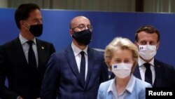 Dutch Prime Minister Mark Rutte, European Council President Charles Michel, French President Emmanuel Macron and European Commission President Ursula von der Leyen are seen wearing face masks during the last roundtable discussion, July 21.
