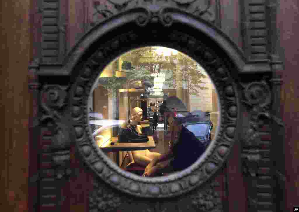 A man sorts goods in a store preparing it for opening in Prague, Czech Republic.