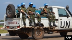 FILE - UN peacekeepers secure a section of the airport on August 12, 2014 as members of the United Nations Security Council arrive in the South Sudanese capital, Juba. 