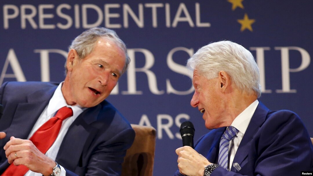 Former U.S. Presidents George W. Bush (L) and Bill Clinton share a laugh during a moderated conversation at the graduation of the inaugural class of the Presidential Leadership Scholars program, a partnership between the presidential centers of George W. 
