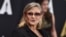 FILE - Carrie Fisher arrives at the Governors Awards at the Dolby Ballroom, Nov. 14, 2015, in Los Angeles. 