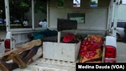 The dead bodies of four suspected Boko Haram members in a Civil Defense pickup van, Abuja, September 20, 2013.