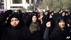 Iranian women chant slogans at a rally in Tehran, Iran, Dec. 30, 2017.