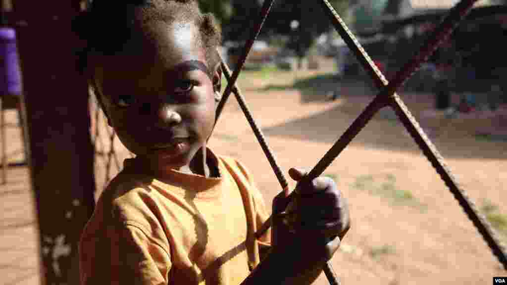 A girl waits at Bossangoa hospital, where medics are treating a high number of children for malaria, malnutrition, anaemia and violence-related injuries inlcuding gunshot wounds, Nov. 9, 2013. (Hanna McNeish for VOA)