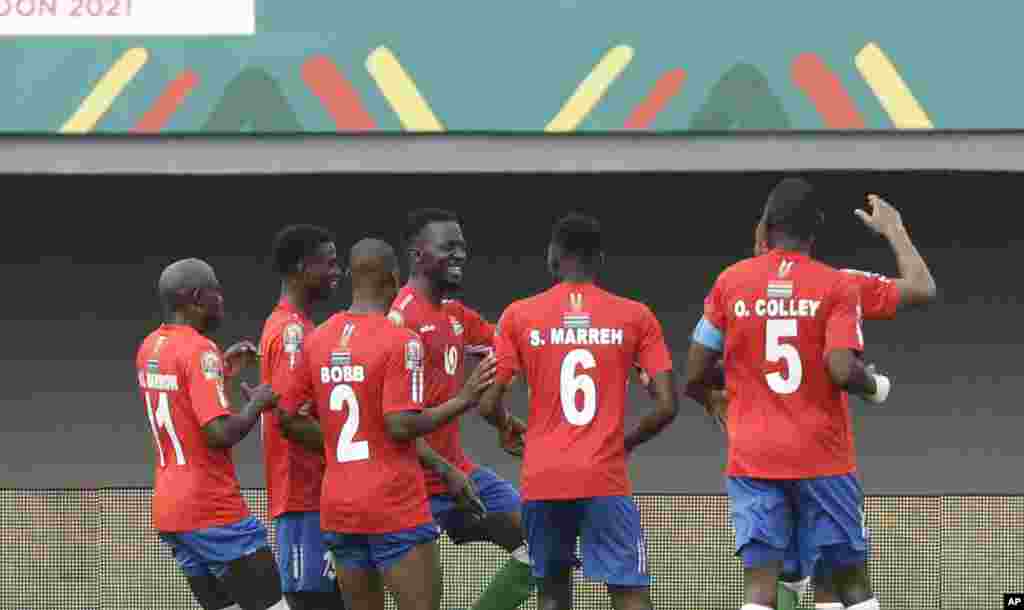 Gambia's players celebrate after teammate Musa Barrow scored his team's first goal, during the soccer match between Gambia and Mali, Cameroon, Jan. 16, 2022.
