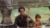 A blind musician plays his traditional Cambodian violin along the promenade at Angkor Wat in Siem Reap on Monday January 22,1996. (AP Photo/Richard Vogel)