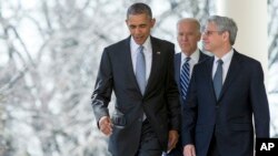 Federal appeals court judge Merrick Garland walks with President Barack Obama and Vice President Joe Biden from the Oval Office to the Rose Garden to be introduced as Obama’s nominee for the Supreme Court at the White House, in Washington on March 16, 2016. 