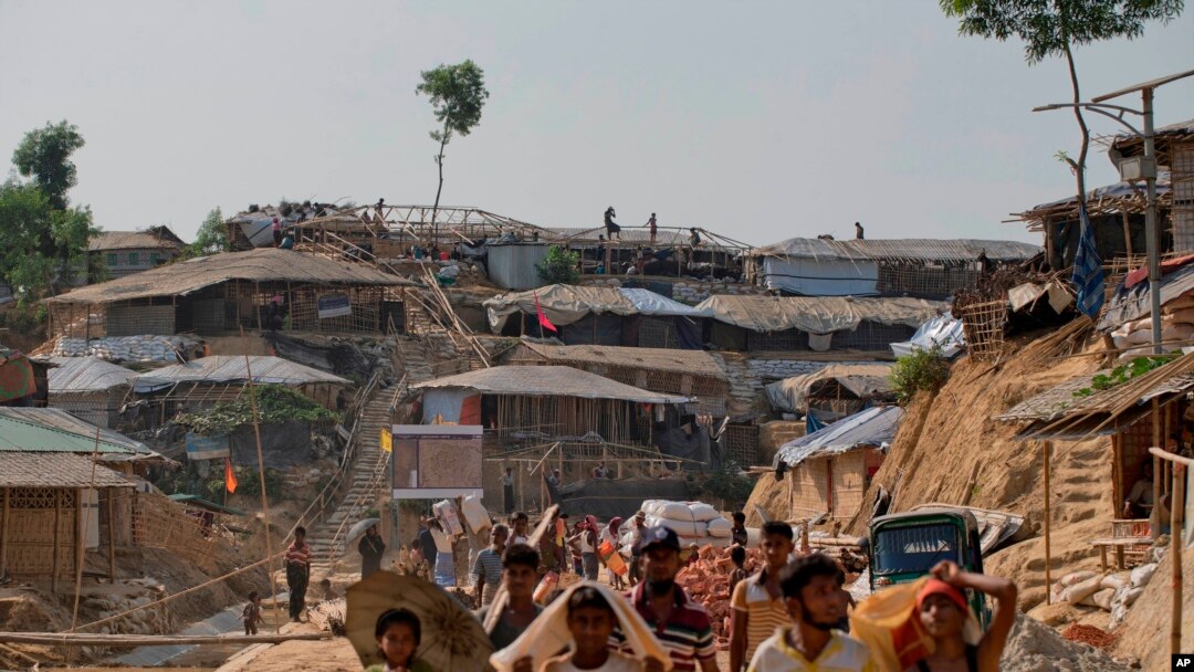 FILE - Rohingya refugees rebuild their makeshift houses, in preparation for the approaching monsoon season at the Kutupalong Rohingya refugee camp in Kutupalong, Bangladesh, April 28, 2018. 