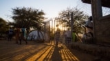 Many come and go freely outside Mother of Mercy hospital. Nuba Mountains. (Adam Bailes/VOA News)