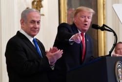 President Donald Trump speaks during an event with Israeli Prime Minister Benjamin Netanyahu in the East Room of the White House in Washington, Jan. 28, 2020.