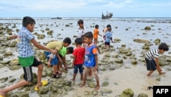 Children of newly arrived Rohingya refugees play at a beach on Sabang island, Aceh province, Indonesia, on Dec. 2, 2023. With the year not over yet, the number of Rohingya fleeing refugee camps in Bangladesh by boat already has eclipsed the 2022 total.
