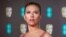 Scarlett Johansson tiba di Bafta Film Awards, di pusat kota London, 2 Februari 2020. Johansson menggugat Walt Disney Co. atas rilis streaming perusahaan "Black Widow," yang katanya melanggar kontraknya dan merampas haknya. (Vianney Le Caer/Invision/AP)