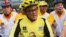 FILE - Aburizal Bakrie cycling with his party members in Jakarta, Oct. 21, 2012. 