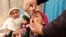 FILE - A child receives a polio vaccination during an anti-polio campaign on the outskirts of Jalalabad, March 16, 2015.