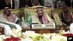 King Salman of Saudi Arabia, center, attends the closing session of the 36th Gulf Cooperation Council Summit in Riyadh, Dec. 10, 2015. The Islamic State has ratcheted up a propaganda campaign against the Gulf kingdom’s ruling family, denouncing them for siding with the U.S.-led coalition against the jihadists and urging followers to oust them.