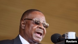 FILE - Former Malawian President Peter Mutharika addresses guests during his inauguration in Blantyre, May 31, 2019. His bodyguard, Norman Chisale, was arrested July 17, 2020, for the second time in a week. 
