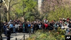 FILE —Immigrants rally at City Hall Park outside City Hall in New York on April 16, 2024. Over 1,500 Black immigrants turned out across from City Hall during a hearing about racial inequities in the city's shelter and immigrant support systems.