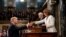 President Donald Trump, before delivering the State of the Union address, shakes the hand of Speaker of the House Nancy Pelosi. Vice President Mike Pence, center, is also in attendance at the Capitol in Washington, February 5, 2019. 