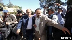 A member of the Houthi delegation participating in the negotiations in Sweden departs from Sanaa airport, Yemen, Dec. 4, 2018.