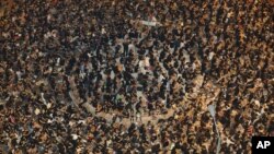 South Sudanese refugees line up for food at the Tzaipi refugee camp in Adjumani, 471 km (293 miles) north of Uganda's capital Kampala. 