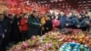 Chinese President Xi Jinping talks to residents as he visits a food market in Shenyang, Liaoning Province, on Jan. 23, 2025, ahead of the Lunar New Year. (Xinhua News Agency via AP)