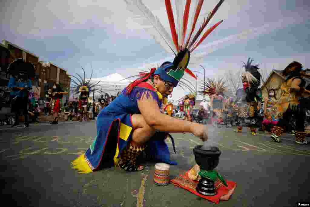 The Kalpulli Ketzalcoatlicue and Kalpulli Tlaloctecuhtli dance groups perform at George Floyd Square during the People&#39;s Power Love Fest in Minneapolis, Minnesota,&nbsp; April 4, 2021.