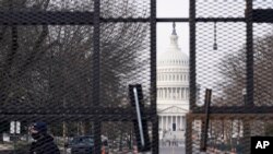 Security surrounds the U.S. Capitol in Washington, Friday, Jan. 15, 2021, ahead of the inauguration of President-elect Joe Biden and Vice President-elect Kamala Harris. (AP Photo/Susan Walsh)