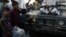 Anak-anak Afghanistan mengamati senjata seorang tentara Taliban di Kabul, Afghanistan, 1 September 2021. WANA (West Asia News Agency) via REUTERS