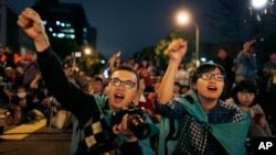 Students cheer on speakers during a gathering to mark the first anniversary of student groups stormed the parliament in Taipei, Taiwan, March 18, 2015. 
